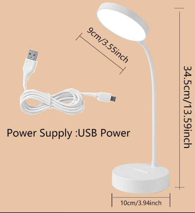 White LED desk lamp with USB cable on a beige background
