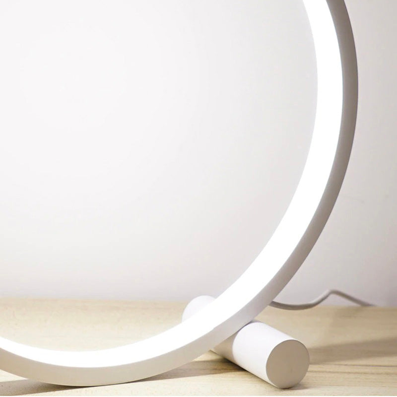 Circular touch-sensitive bedside lamp