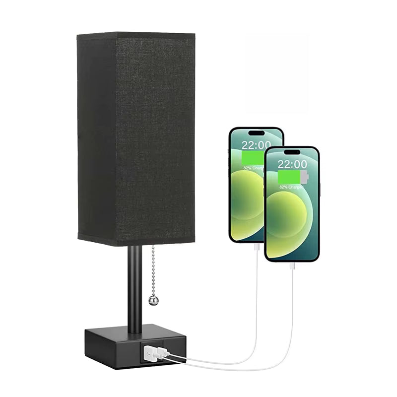 Black lamp with USB charging port and two smartphones displaying battery icons.