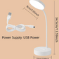 White LED desk lamp with USB cable on a beige background