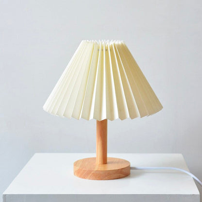 Wooden bedside lamp with folded shade