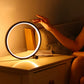 Circular touch-sensitive bedside lamp